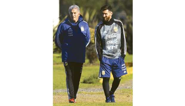 Argentinau2019s captain Lionel Messi (right) with team manager Jorge Burruchaga during a training session in Ezeiza, Buenos Aires, yesterday. (AFP)