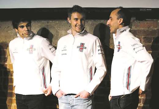 Williams drivers Lance Stroll (left), Sergey Sirotkin (centre), and reserve and development driver Robert Kubica during the launch of the car in February this year. (Reuters)