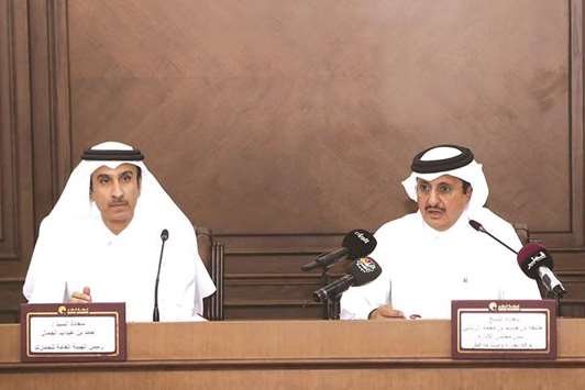 Sheikh Khalifa announces the implementation of the ATA Carnet system from August 1 in the presence of al-Jamal during a press conference in Doha yesterday.