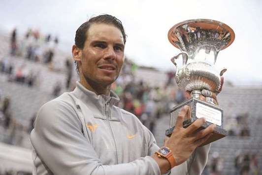Spainu2019s Rafael Nadal poses with the trophy after winning the Italian Open in Rome on Sunday. (AFP)