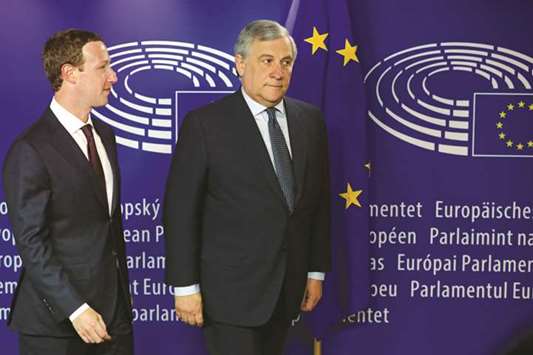 Facebooku2019s CEO Mark Zuckerberg and European Parliament President Antonio Tajani arrive at the European Parliament in Brussels yesterday. In his opening remarks, Zuckerberg said it had u201cbecome clear over the last couple of years that we havenu2019t done enough to prevent the tools weu2019ve built from being used for harm as well.u201d
