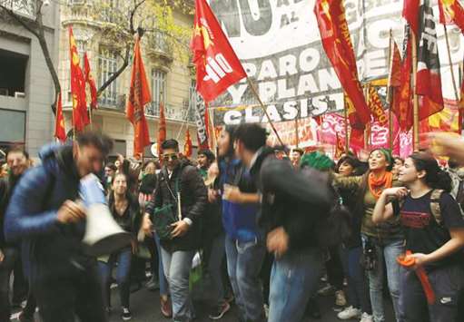 Demonstrators participate in a rally during May Day commemoration in Buenos Aires on Tuesday.