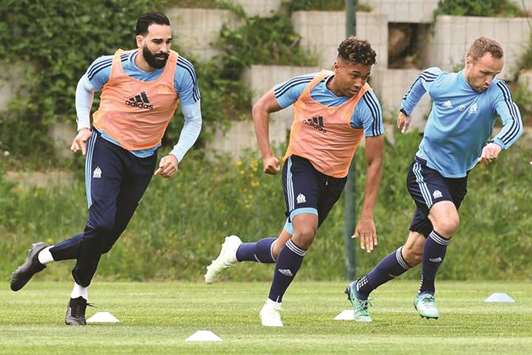 Marseille players warm up during a training session on the eve of the Europa League semi-final match against RB Salzburg in Marseille, France, yesterday. (AFP)