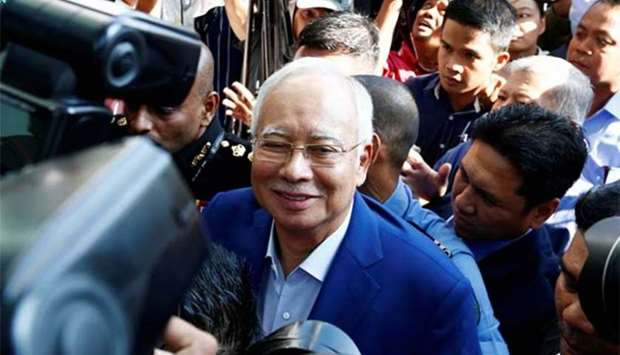 Malaysia's former prime minister Najib Razak arrives to give a statement to the Malaysian Anti-Corruption Commission in Putrajaya on Tuesday.