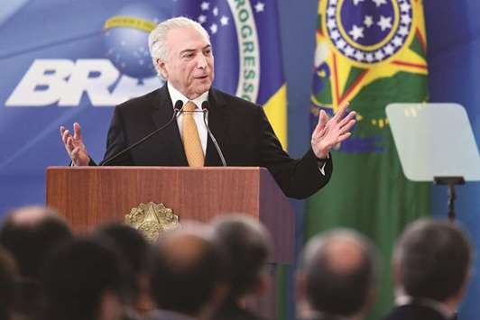 Brazilian President Michel Temer delivers a speech, during the launching event of a platform for the adherence to economic plans, at the Planalto Palace in Brasilia yesterday.