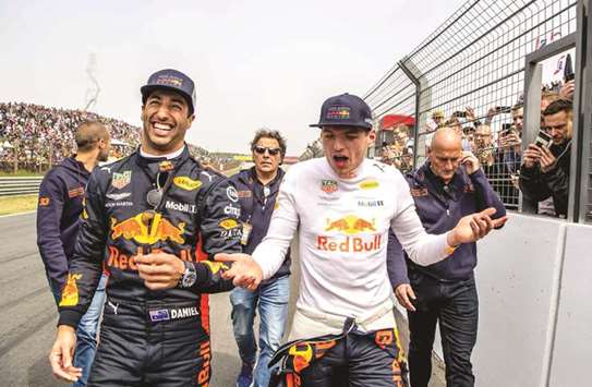 Red Bull drivers Daniel Ricciardo (left) and Max Verstappen react during the Jumbo Racing Days at the Circuit Park Zandvoort in Zandvoort, Netherlands, on Sunday. (AFP)