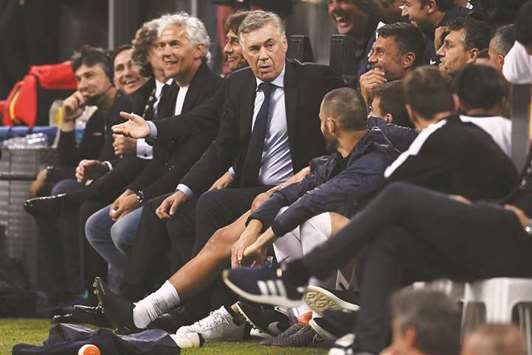 Carlo Ancelotti (centre) looks on during former Italy midfielder Andrea Pirlou2019s testimonial u2018Night of the Masteru2019 match at the San Siro in Milan on Monday night. (AFP)