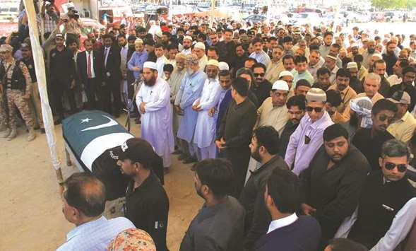 Relatives, residents and government officials offer funeral prayers for slain exchange student Sabika Sheikh, who was killed during a school shooting in Texas, following her bodyu2019s arrival from the United States, in Karachi yesterday.