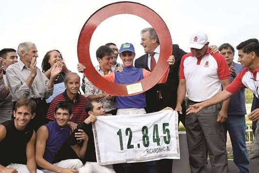 WORLD RECORD: Jorge Ricardo, centre, celebrates his record breaking feat.