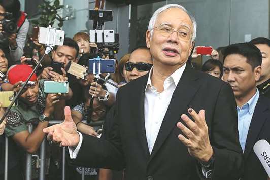 Malaysiau2019s former prime minister Najib Razak speaks to the media after being questioned at the Malaysian Anti-Corruption Commission (MACC) office in Putrajaya yesterday.