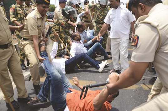 Police stop Congress workers agitating against the hike in petrol and diesel prices in Mumbai yesterday.