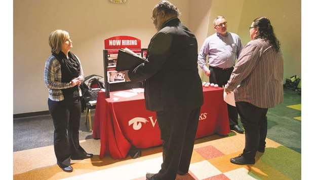 Job seekers meet with recruiters at the Columbus Career Fair in Ohio. While other data yesterday showed an increase in the number of Americans filing for unemployment benefits last week, the trend in claims continued to point to a tightening labour market.