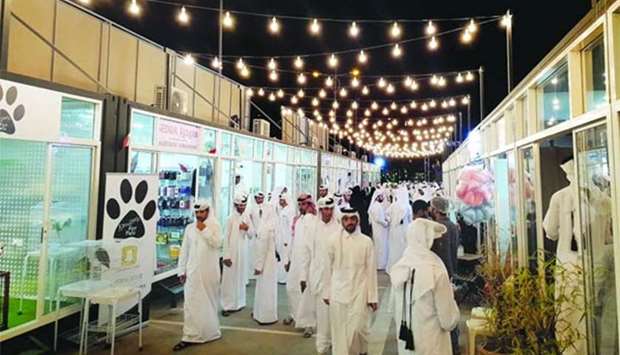 Throngs of visitors flock to the Night Market at the Al Duhail Sports Club parking lot. PICTURES: Peter Alagos.