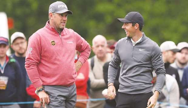 Northern Irelandu2019s Rory McIlroy (right) and Englandu2019s Lee Westwood during the second round of the PGA Championship in Virginia Water, Britain. (Reuters)