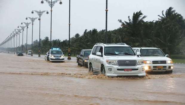 A picture taken yesterday, shows cars driving through a flooded street in the southern city of Salalah, prior to the landfall of Cyclone Mekunu. Heavy rains and strong winds pummelled Dhofar province, with an AFP photographer in Salalah saying the city has been lashed non-stop for several hours.
