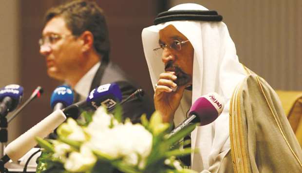 Saudi Energy Minister Khalid al-Falih (right) and Russian Energy Minister Alexander Novak attend a news conference in Riyadh. Oil supply caps may be scaled back later this year, though no decision has been made, al-Falih said. Brent futures for July settlement traded at $76.60 a barrel on the London-based ICE Futures Europe exchange, down $2.19, and headed for a weekly drop for the first time in seven weeks.
