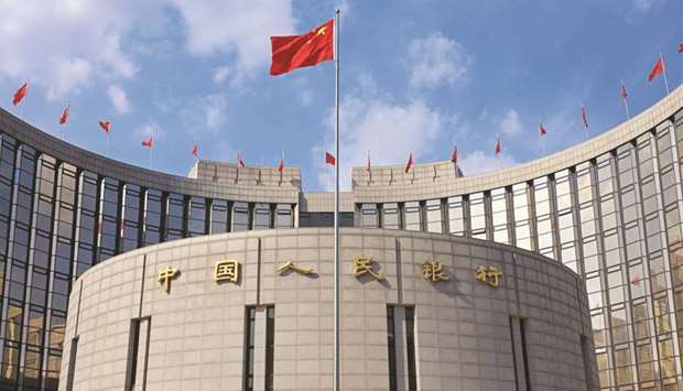 The Peopleu2019s Bank of China building is seen in Beijing. The State Bank of Pakistan and Peopleu2019s Bank of China have agreed to increase the currency swap arrangement amount from 10bn Chinese yuan to 20bn yuan and from Rs165bn to Rs351bn, the SBP said in a statement yesterday.