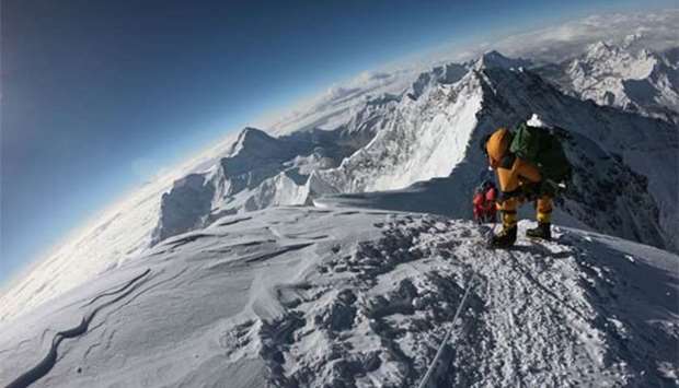 Mountaineers make their way to the summit of the Mount Everest.