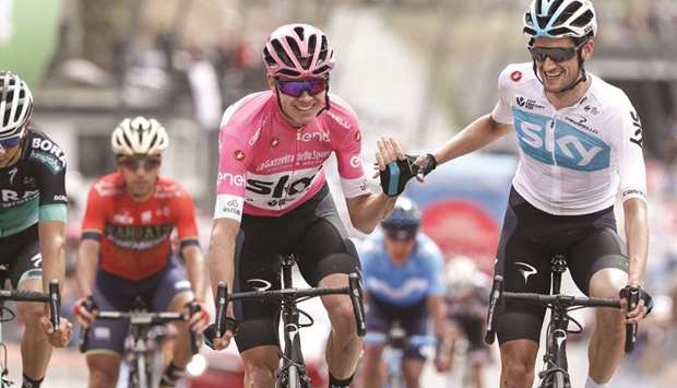 British rider Christopher Froome (left) crosses the finish line with Dutch teammate Wout Poels during the 20th stage from Susa to Breuil-Cervinia of the 101th Giro du2019Italia in Cervinia, Italy. (AFP)