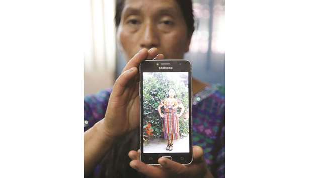 Dominga Vicente shows a picture of her niece Claudia Gomez, a Guatemalan immigrant killed by a US Border Patrol officer on Wednesday while entering Texas illegally, during a news conference in Guatemala City on Friday.
