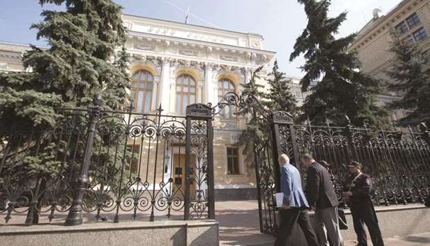Visitors pass security to enter the headquarters of Russiau2019s central bank in Moscow (file). The central bank spent at least $16bn on the rescue and takeover of three leading private lenders last year in a move it says was necessary to save the financial system.