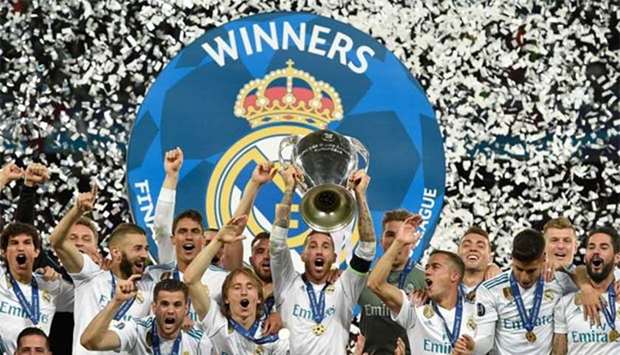 Real Madrid's Spanish defender Sergio Ramos (centre) holds the trophy after winning the UEFA Champions League final at the Olympic Stadium in Kiev on Saturday.