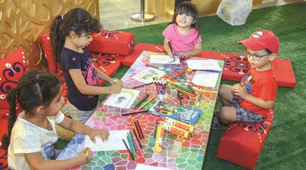 Children enjoy a colouring book event at Ezdan Mall.