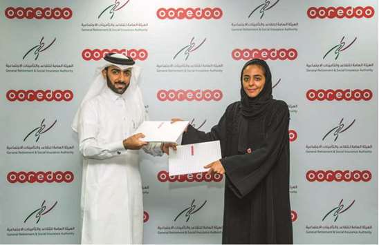 Al-Malki and al-Muraikhi at the agreement signing under which Ooredoo will be offering special discounts and tailor-made value packages to retired customers in Qatar on a range of products, including data packs, Ooredoo tv and Shahry lines in partnership with the General Retirement and Social Insurance Authority.