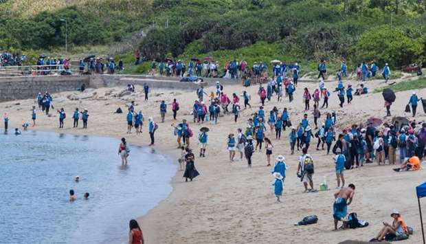 Participants take part in a beach clean-up on Hong Kong's outlying Lamma island