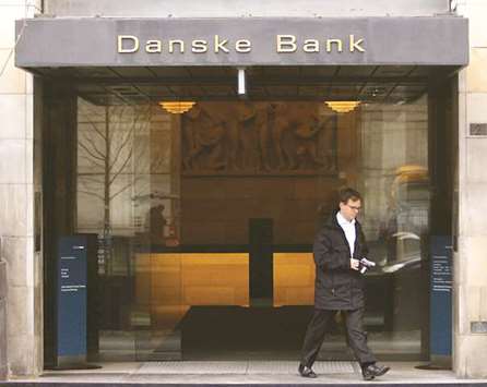 A man exits the Danske Bank headquarters in Copenhagen. The latest government rebuke comes after a report by police revealed that a far larger sum than originally estimated passed through banks operating in Estonia, where Danske was embroiled in a laundering scandal for which it was reprimanded by the Danish regulator this month.