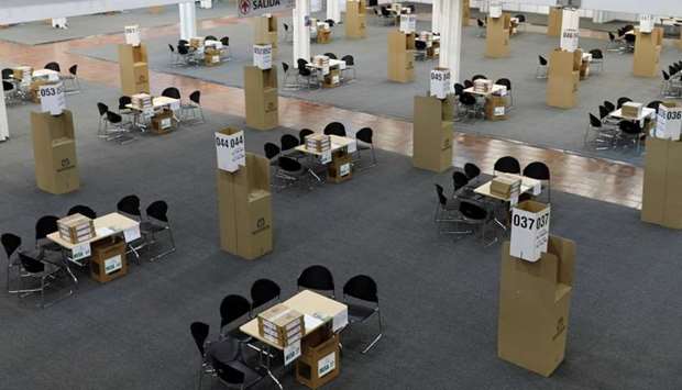 Tables and ballot boxes are set up at a convention centre turned polling station in Bogota, Colombia 