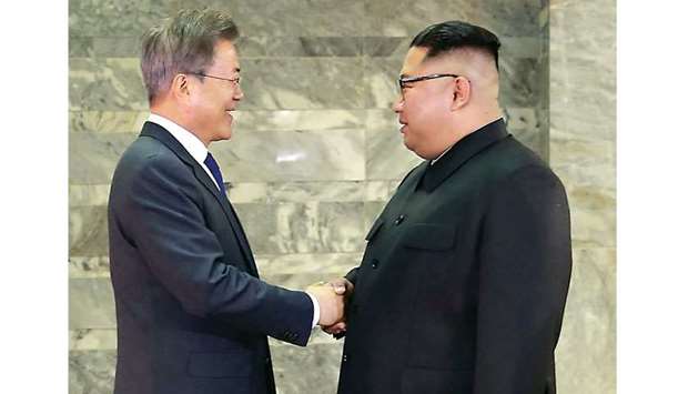 South Koreau2019s President Moon Jae-in shaking hands with North Koreau2019s leader Kim Jong-un before their second summit at the north side of the truce village of Panmunjom in the Demilitarized Zone (DMZ).