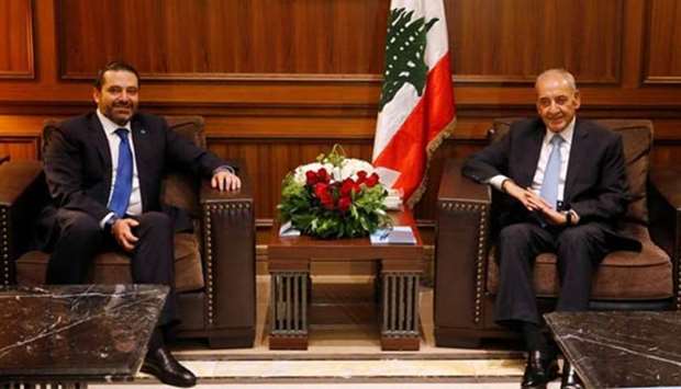 Lebanese Parliament Speaker Nabih Berri sits with Prime Minister-designate Saad al-Hariri inside the parliament building in Beirut on Monday.