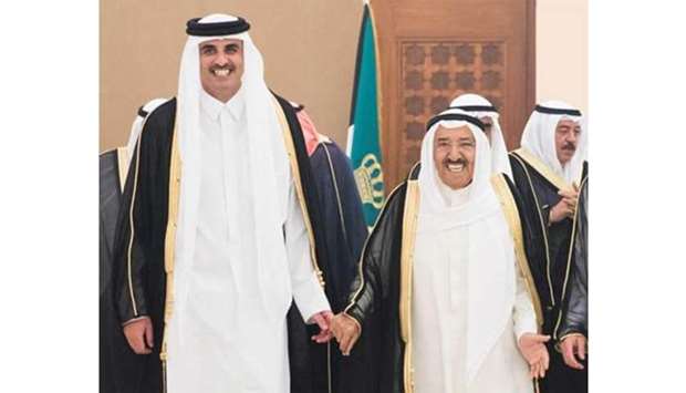 His Highness the Amir Sheikh Tamim bin Hamad al-Thani with the Amir of Kuwait Sheikh Sabah al-Ahmed al-Jaber al-Sabah in Kuwait on Monday.