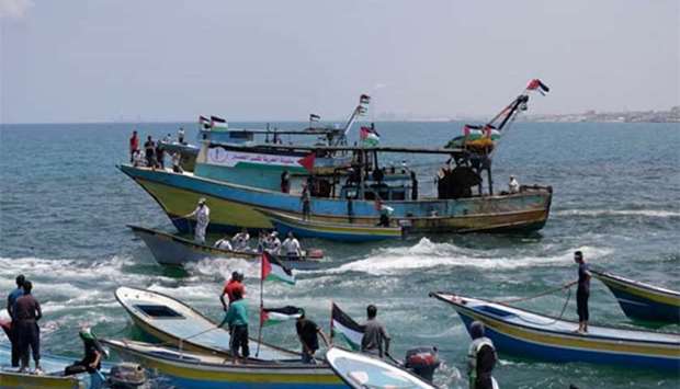 Fishing boats carrying a group of Palestinian activists setting to sail from Gaza City harbour on Tuesday.