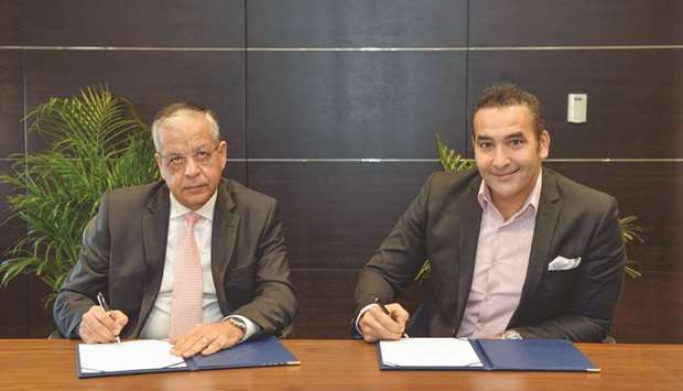 QIB and QPAY executives at the agreement signing.