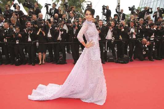 POSER: Mallika Sherwat made yet another appearance at Cannes. What are her credentials for going to Cannes year after year? Whom does she represent? Has she ever had a single film of hers shown at Cannes? Does she even qualify as an actor anymore, asks the author.