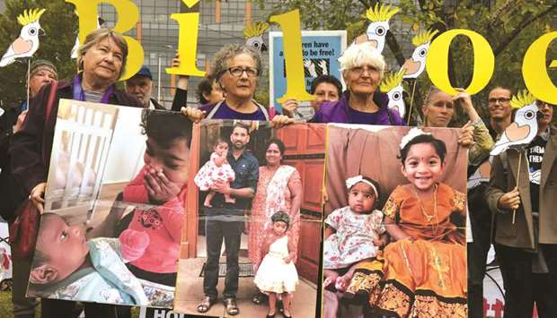 Supporters of a Queensland asylum seeker family facing forced removal to Sri Lanka rally outside the federal court in Melbourne yesterday.