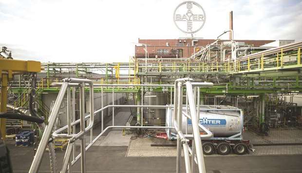 A Bayer logo is seen at the Bayer CropScience crop protection production site in Dormagen, Germany. For Bayer, acquiring Monsanto is the last step in a corporate transformation as the 154-year-old company shed its plastics business and remade itself as a life-science company with equally-sized health and agriculture units.