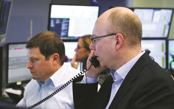 Traders at the Frankfurt Stock Exchange. The DAX 30 gained 0.9% to 12,783.76 points yesterday.