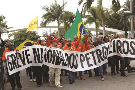 Brazil oil workers attend a protest during a 72-hour strike yesterday outside the Petrobras oil refinery in Duque de Caxias near Rio de Janeiro.