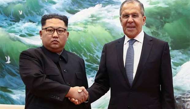 Russian Foreign Minister Sergei Lavrov shakes hands with North Korean leader Kim Jong Un during a meeting in Pyongyang on Thursday.