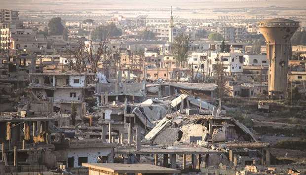 A picture taken yesterday shows a general view of destroyed buildings in a rebel-held area in the southern Syrian city of Daraa.