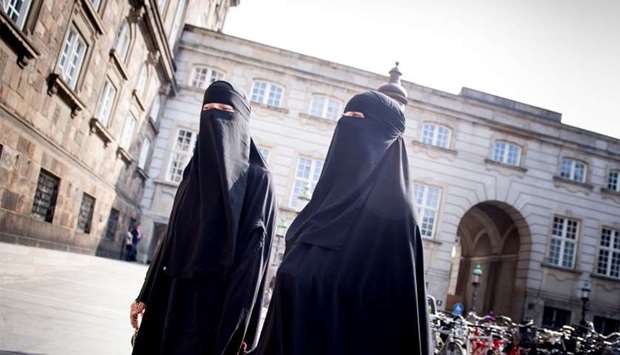 Women in niqab are pictured wearing face veils in public, at Christiansborg Palace in Copenhagen, Denmark
