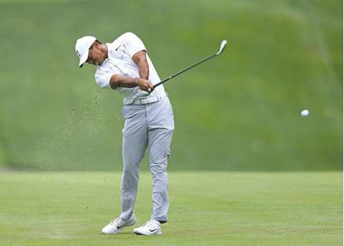 Tiger Woods of the United States hits his second shot on the 11th hole during the first round of The Memorial Tournament at Muirfield Village Golf Club in Dublin, Ohio, yesterday. (Getty Images/AFP)