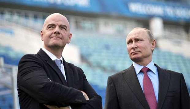 Russian President Vladimir Putin and FIFA president Gianni Infantino visit the Fisht Stadium in Sochi on Thursday.