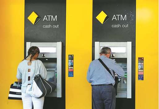 People use Commonwealth Bank of Australia ATMs in Sydney. Australiau2019s top lender confirmed yesterday it lost records of almost 20mn accounts and decided to not inform its clients, a breach the nationu2019s prime minister called u201can extraordinary blunderu201d.