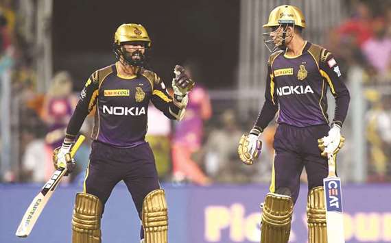 Kolkata Knight Riders captain Dinesh Karthik (left) talks with teammate Shubman Gill during the 2018 Indian Premier League match against Chennai Super Kings at the Eden Gardens Cricket Stadium in Kolkata yesterday. (AFP)