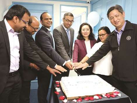 Ahamed (third left) inaugurating LuLu Financial Groupu2019s operations in Hong Kong.