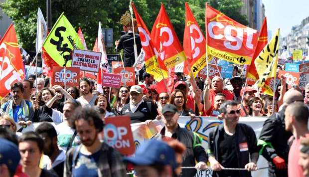 Unionists march during a rally called to protest against policies of the French president on the first anniversary of his election